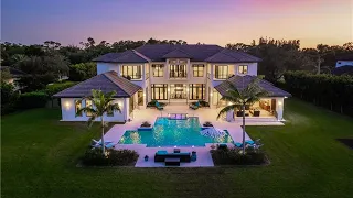 A $8,925,000 Custom home in Naples with resort like backyard and landscaped gardens