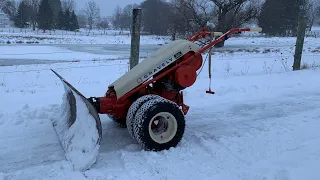 Gravely tractor plowing snow