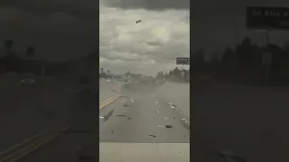 Tire shoots off truck, sends car flying through air in LA traffic -- wild video