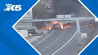 Officials say truck crash and fire on I-405 was hit and run