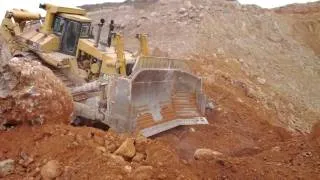 Caterpillar D11R pushing a massive rock 3