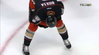 Bieksa leaves game after taking puck to chin