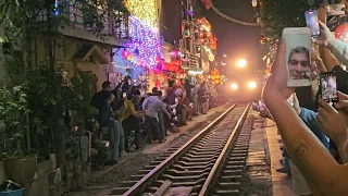 Train street Hanoi, Vietnam, crazy people near train