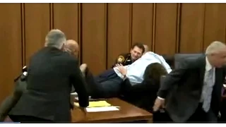 RAW: Father takes flying leap over desk to attack serial killer in court