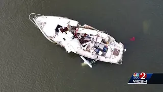 Good Samaritan rescues three people after yacht rams sailboat, speeds off