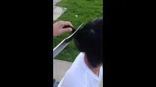 Cutting hair with a sword
