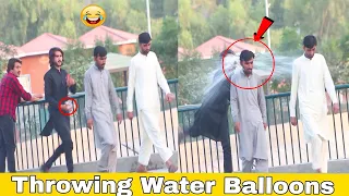 Throwing Water Ballon From Bike Throwing water Balloons prank In 2023