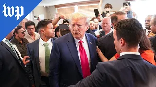 Trump greets supporters after his arrest