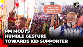 PM Modi’s humble gesture towards his kid supporter during his rally in MP’s Jhabua