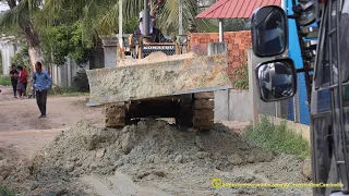 Activities Dump Trucks Pouring Soil And Komatsu D20A Dozer Pushes To Build Roads In The Village