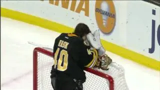 Tuukka Rask stops puck with mask 1/21/12