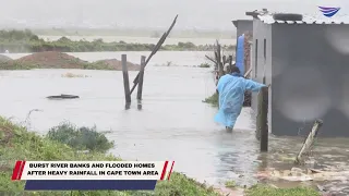 Burst river banks and flooded homes  after heavy rainfall in Cape Town area