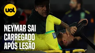 NEYMAR SAI DE CAMPO CHORANDO APÓS LESÃO NO JOELHO EM JOGO ENTRE BRASIL E URUGUAI