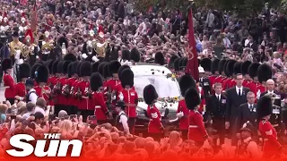 Queen's coffin makes final journey to Windsor greeted by crowds of mourners