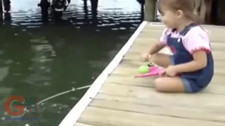 Girl Catching Fish With A Little Barbie Fishing Rod