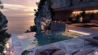 Lounge with view of calm ocean and infinity pool