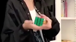Kaia Gerber trying to solve rubics cube