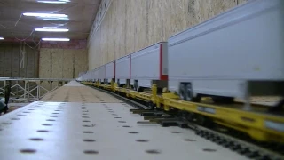 Very long CSX intermodal train in HO scale with Autoracks