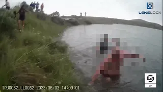 Body camera footage shows police rescuing unconscious girl from submerged car