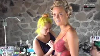 Caroline Wozniacki gets her body painted in the nude.