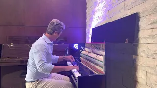 Evgeny Khmara plays in music store in Amman, Jordan