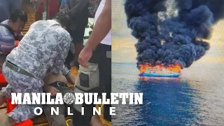 Philippine Coast Guard personnel try to resuscitate a man during a sea mishap on Polilio Island