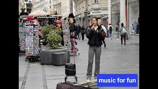 beautiful singing, gentle voice, Belgrade street