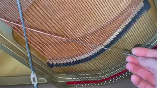 How to fix a rattling bass string in a Piano