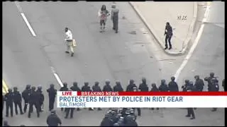 Protesters met by police in riot gear