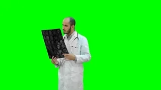 Doctor Examining Xray Results on a Green Screen, Chroma Key | Stock Footage - Videohive