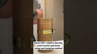 Dense sand triaxial specimen using wet tamping preparation method