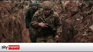 Ukraine troops ready to defend themselves in trenches