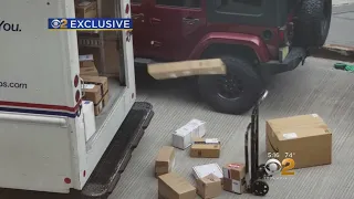 EXCLUSIVE: USPS Worker Caught On Camera Tossing Packages Out Of Mail Truck