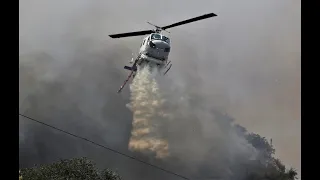 HELICOPTERS PROVIDING AERIAL SUPPORT TO GROUND FIREFIGHTERS - CAPE TOWN.