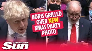 Boris Johnson grilled over NEW Christmas parties picture with bottle of bubbly on desk