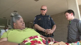 Officer Tommy Norman takes foster child on daily routine