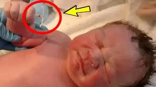 The doctors brought the baby in after birth. Look what the baby was holding in his hands!