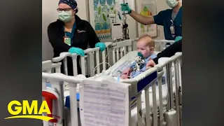 Toddler cheered on by hospital staff before heart transplant surgery