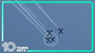 Two jets touch wings while flying in formation at Florida air show