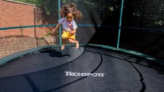 James playing on the trampoline