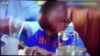 black kid spilled orange juice during dinner