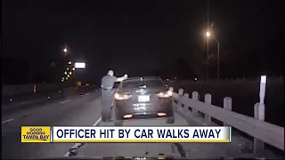 WATCH: Car plows into police officer during traffic stop