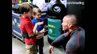 Randy Orton with 2 littles fans in the backstage