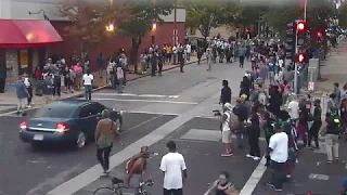 Watch: Surveillance video shows unmarked car backing through protesters