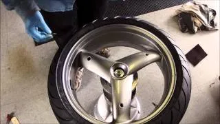 Bubble balancing a single sided swingarm motorcycle wheel