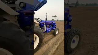 Farmtrac 6055 Powermax on 10 ft rotavator, with both lever down