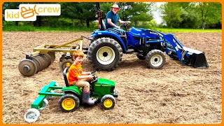 Plowing dirt and planting corn on the farm with kids tractor. Educational front loaders | Kid Crew