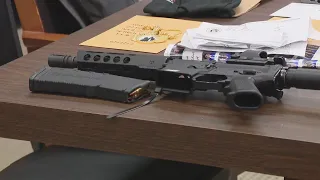 2 arrested after AR-15 found next to teen's bed during search of convicted felon's home
