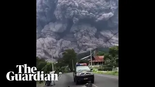 People flee as black cloud of volcanic ash towers above them in Guatemala