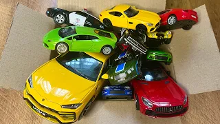 Box full of various miniature cars Jaguar, Peugeot, Renault, Hyundai, Mazda, Volvo, Honda, Opel #592